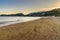 Beach on Tombolo della Feniglia in Orbetello on peninsula Argentario at sunset. Italy