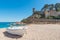 Beach at Tossa de Mar and fortress in a beautiful summer day, Co