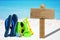 Beach toys and emty wooden signboard