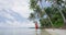 Beach travel woman walking on paradise beach on holidays vacation on Bora Bora