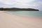 A beach and a tropical forest in the background on the Great Keppel Island in the Tropic of Capricorn area in Central Queensland