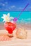 Beach tropical red cocktail on caribbean white sand flower