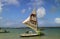 Beach with typical sail boats of northeast Brazil