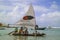 Beach with typical sail boats of northeast Brazil