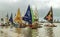 Beach with typical sail boats of northeast Brazil