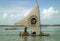 Beach with typical sail boats of northeast Brazil