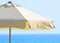 Beach umbrella against the sea and sky