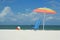 Beach umbrella, chair and ball