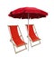 Beach umbrella and deckchairs