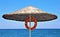 Beach umbrella with lifebuoy on the Mediterranean sea coast, Kemer, Turkey