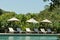 Beach umbrella, Selective focus point at towel pool on empty beach bed around swimming pool