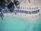 Beach Umbrellas on a Beautiful White Sand Beach - Aerial View