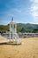 Beach umbrellas, chaise lounge and Lifeguard tower on the sand beach of Sperlonga