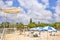 Beach umbrellas and Lifeguard chairs on the sandy beach Naminoue in Naha City in Okinawa Prefecture, Japan