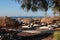 Beach umbrellas and sun beds on a black sand empty beach without people