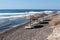 Beach umbrellas and sun beds, empty beach without people