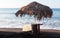 Beach umbrellas and sun beds on the sand, mountain on background