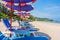 Beach umbrellas and sunbath seats on Phuket sand beach