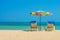 Beach umbrellas and sunbathe seats on Phuket sand beach