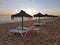 Beach umbrellas at sunset on Aruba island