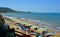 Beach with umbrellas and unidentified people at crowded beach near estuary of fortore