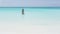 Beach vacation bikini woman swimming in blue ocean