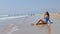 Beach vacation people - woman relaxing on the sandy beach.