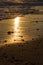 Beach vacation. Romantic evening sunlight reflecting off sand