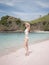 Beach vacation. Travel holiday panorama concept, girl sunbathing with sun hat lying. Horizontal, lifestyle. Woman in white bikini