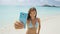 Beach vacation travel woman taking smart phone selfie in bikini having fun