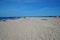 Beach with vacationers on the coast of the Baltic Bay in the village of Rewa, Poland