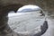 Beach view through drift wood hole,Port Renfrew