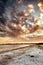 Beach view of sky and clouds at sunset with calm sea water in summer. Nature landscape of a coastline with a cloudy