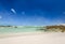 Beach view with white sand, rocks and crystal clear water at Brandfontein - Rietfontein Nature Reserve near Cape Agulhas