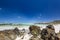 Beach view with white sand, rocks and crystal clear water at Brandfontein - Rietfontein Nature Reserve near Cape Agulhas