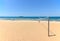 Beach Volleyball net on sandy beach with sea