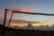 Beach with volleyball net at sunrise