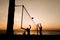 Beach volleyball silhouette at sunset