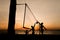 Beach volleyball silhouette at sunset