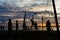 Beach volleyball, sunset, silhouettes of players on sea