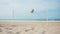 Beach volleyball. Surreal mood. Big ball flying over the net on empty sand beach by the sea. Coastal landscape. Generative AI