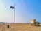 The beach of vrouwenpolder with flag and beach cottage, Zeeland, The Netherlands