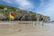 Beach warning flag standing on the sands of St.Agnes beach cove