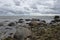 Beach wavy Baltic Sea with boulders