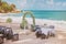 Beach wedding venue setting with flower decoration on arch, panoramic ocean view