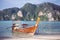 Beach with white sand landscape. Boat mooring in Asian style, canoe.