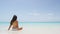 Beach woman enjoying serene luxury vacation sun on holidays travel