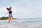 beach woman young summer sunset lifestyle travel running sea carefree smile
