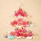 Beach Xmas concept on sand as a Christmas tree with shells and f