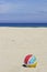 Beachball on empty sandy beach